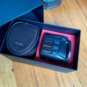 TUMI grounded electric plug adaptor